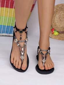 新款女式黑色防滑鞋底通勤度假两用夏季畅销赤脚轻便鞋，金属装饰平底凉鞋