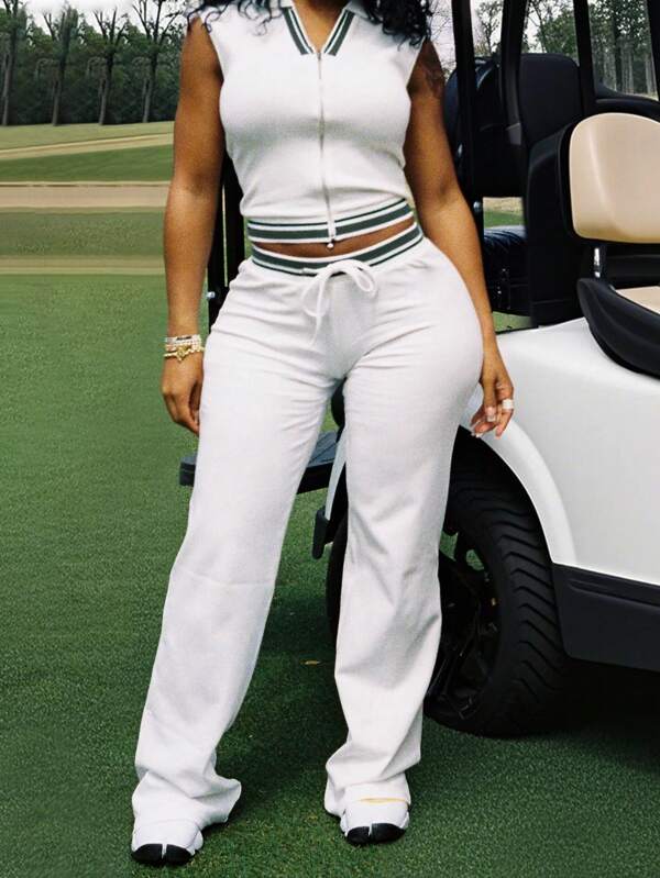 LovelyWholesale Conjunto de dos piezas de mujer con chaleco casual con estampado de rayas y cremallera, y pantalones con cordón - Ropa de mujer para otoño