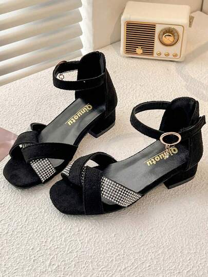 2025 New Girls' Small Heel Sandals. Black Suede Upper, Criss-Cross Strap Design With Shiny Rhinestones. Ankle Strap Closure. Low Heel, Fashionable And Elegant. This Princess-Style High Heel Sandal Is Suitable For 3-12 Year Old Girls To Wear On Formal Occasions Or With Dresses, Showcasing A Graceful Style.