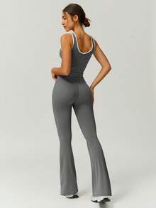 Set de 2 piezas de top deportivo y pantalones acampanados de mujer con diseño de contraste de color y cruce de cintura a la moda