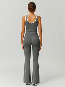 Set de 2 piezas de top deportivo y pantalones acampanados de mujer con diseño de contraste de color y cruce de cintura a la moda