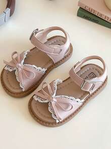 A Pair Of Best-Selling Pink Children's Sandals With A Pink Strap And Metal Clasp, A Pink Bow At The Front And Lace Lace. The Style Is Sweet And Fresh, Belongs To The Summer Fashion Style, Suitable For Children's Daily, Holiday And Other Scenes, Suitable For 3-12 Years Old Children - Pink - View 3