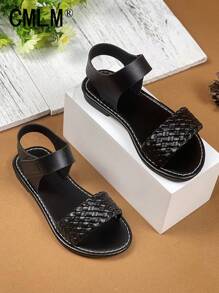 1 par de sandalias abiertas de niña pequeña con correa de PU de color negro sólido, estilo trenzado con , puntera redonda, cómodas y de moda tipo romanas, apropiadas para niñas de 3 a 12 años, para uso diario, casual, vacaciones, primavera/verano 2025