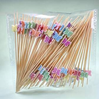300/200/100/50/20 stuks kleurrijke vlinderbamboe decoratieve stokjes - wegwerpfruitstokjes voor feestjes, fruitvork, tandenstoker, bamboestokje, feest- en tafeldecoratie, elegant vlinderontwerp in verschillende kleuren (rood, geel, blauw, paars) (kleurmix haar)