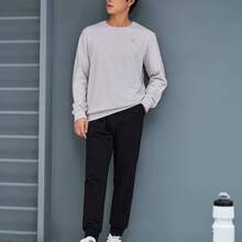 XTEP Pantalones deportivos Nuevos pantalones de entrenamiento integral de punto para hombres, primavera, aptitud 876329630163