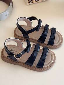 A Pair Of Popular Sandals With Multiple Straps And Bow Trim, A Metal Buckle Design And A Brown Sole. The Style Is Simple And Fashionable, Belongs To The Summer Popular Style, Suitable For Children's Daily Activities, Vacation And Other Scenes, Suitable For 3-12 Years Old Children To Wear - Black - View 2