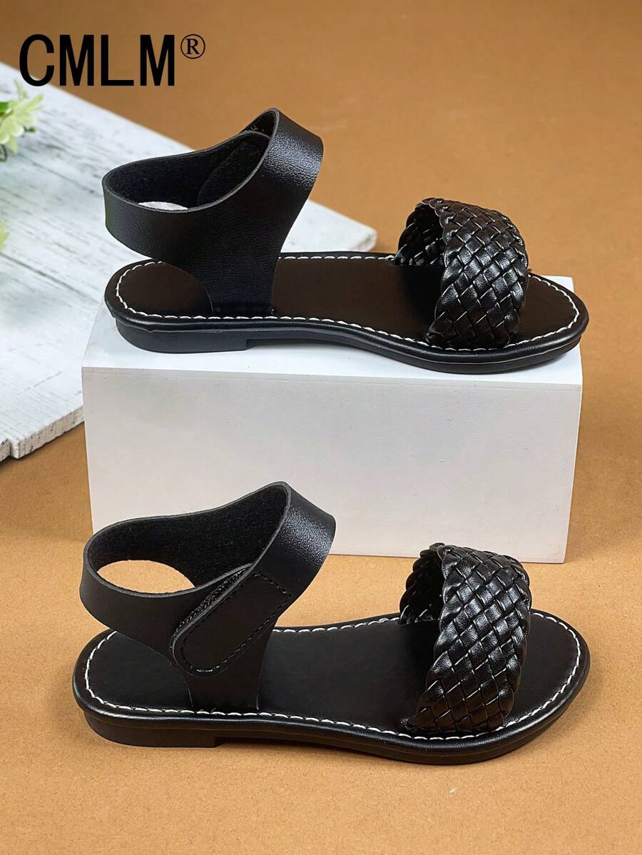 1 par de sandalias abiertas de niña pequeña con correa de PU de color negro sólido, estilo trenzado con , puntera redonda, cómodas y de moda tipo romanas, apropiadas para niñas de 3 a 12 años, para uso diario, casual, vacaciones, primavera/verano 2025