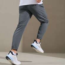 XTEP Athletic Pants For Men, Spring/Fall 2025 Official Quick-Dry Breathable Woven Athletic Pants, Casual Training Gym Pants. 876229980205