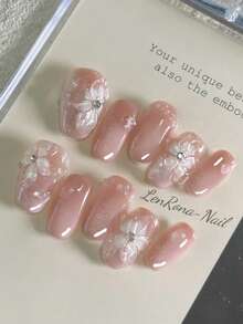Juego de 10 uñas artificiales DIY, con forma de lirio de 3D hecho a mano, con superficie degradada rosa y decoraciones irregulares de gotas de agua. Después de usarlas, hace que las manos se vean talla grande claras, elegantes y encantadoramente simples. El set incluye 1 uña artificial, 1 gel y 1 lima de uñas. Adecuado para la vida diaria, bodas, negocios, fiestas y otras ocasiones. - Rosa - Ver 1