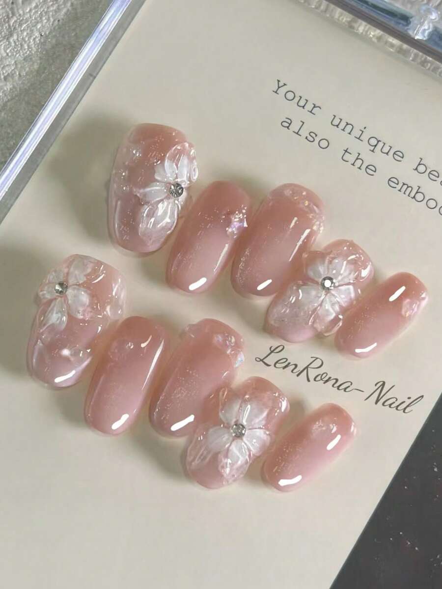 Juego de 10 uñas artificiales DIY, con forma de lirio de 3D hecho a mano, con superficie degradada rosa y decoraciones irregulares de gotas de agua. Después de usarlas, hace que las manos se vean talla grande claras, elegantes y encantadoramente simples. El set incluye 1 uña artificial, 1 gel y 1 lima de uñas. Adecuado para la vida diaria, bodas, negocios, fiestas y otras ocasiones. - Rosa - Ver 1