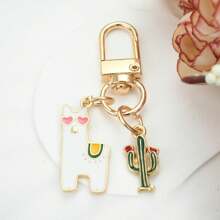 1 pièce Mignonne porte-clés Alpaga Cactus Dessin Animé œil d'Amour, Porte-clés Pendant Alpaga Cactus DIY Adorable, Porte-clés Polyvalent, Charm de Téléphone, Cadeau Idéal pour Vacances, Accessoires de Voiture, Charm de Sac à Dos pour l'École