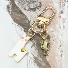 1 pièce Mignonne porte-clés Alpaga Cactus Dessin Animé œil d'Amour, Porte-clés Pendant Alpaga Cactus DIY Adorable, Porte-clés Polyvalent, Charm de Téléphone, Cadeau Idéal pour Vacances, Accessoires de Voiture, Charm de Sac à Dos pour l'École
