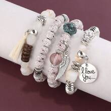 Set de 4 pulseras multicapa con flecos y cuentas