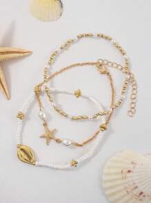 3 pièces/set Bracelet vintage multicouche en perles de riz, pendentif avec éléments marins étoile de mer et coquillage, bijoux bohèmes de plage et de vacances pour femmes, accessoire sexy pour bikini et soirée (quantité et séquence de perles aléatoires)