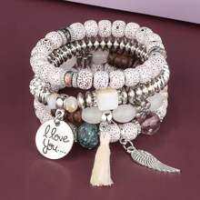 Set de 4 pulseras multicapa con flecos y cuentas
