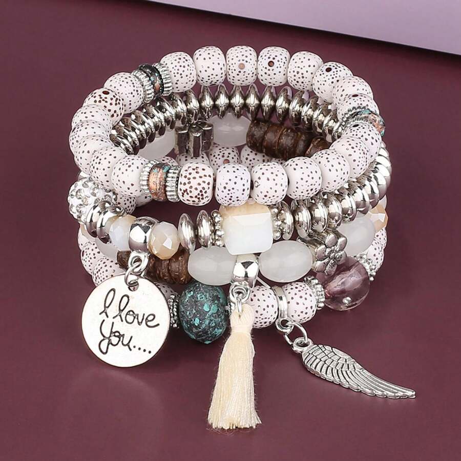 Set de 4 pulseras multicapa con flecos y cuentas