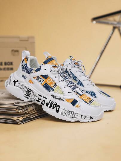 男士时尚字母图形撞色涂鸦随机印花系带圆头厚底运动鞋，适合青少年和校园的个性化休闲运动鞋