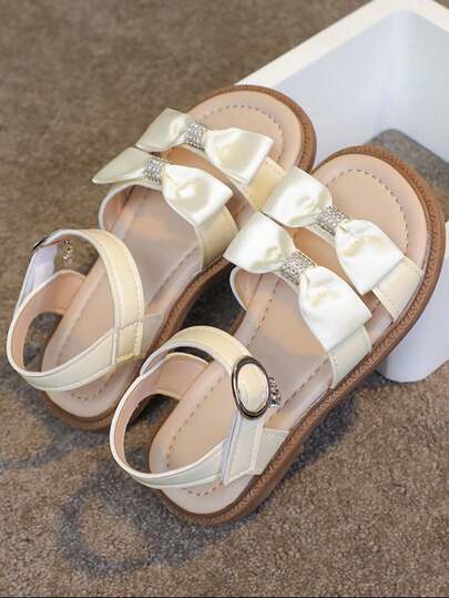 1 Đôi giày sandal đế bằng màu trơn đính nơ thời trang đơn giản thanh lịch cho bé gái, thích hợp cho mùa hè