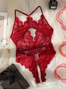 Body sexy de mujer con cuello en V profundo transparente, tejido jacquard, espalda descubierta, decoración de lazo en el pecho, encaje floral cruzado en la entrepierna, decoración de hebilla metálica con forma de corazón, recorte ondulado, tirantes ajustables