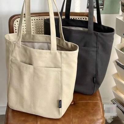 حقيبة كتف كانفاس للنساء موديل 2025 الجديد، مناسبة لطلبة الجامعة لحمل الكتب إلى الفصول الدراسية، وممتازة أيضًا للتنقل اليومي والاستخدام العادي. إنها حقيبة كتف واسعة الحجم.