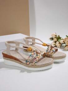 Sandales compensées d'été neuves pour femmes, avec fond épais. Décor de strass, style bohème tressé à bout rond ouvert. Confortable, légère, talon compensé, semelle corde. Parfait pour la plage et les vacances. Idéal comme cadeau.