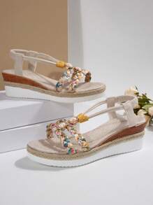Sandales compensées d'été neuves pour femmes, avec fond épais. Décor de strass, style bohème tressé à bout rond ouvert. Confortable, légère, talon compensé, semelle corde. Parfait pour la plage et les vacances. Idéal comme cadeau.