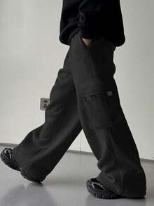 1 chiếc quần thể thao dáng rộng đơn giản cho bé trai tuổi teen, thích hợp tập luyện ngoài trời, có túi bên hông, dày dặn và ấm áp, phù hợp cho mùa xuân, thu và đông. - màu đen - Xem 5