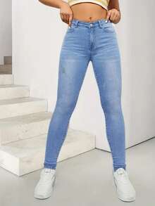 Vaqueros ajustados de talle alto y lavados de color azul claro para mujer con rayones - Azul - Ver 1