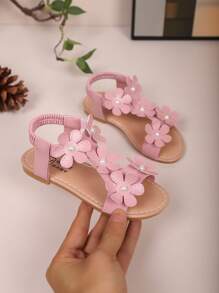 Sandalias con decoración de flores para niños mayores, zapatos de princesa para niñas, zapatos planos informales de playa con correa elástica para estudiantes de primaria, estampado floral de moda, de verano