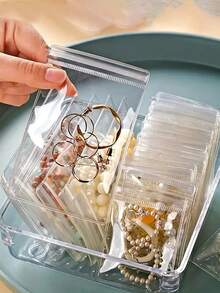 100个抗氧化珠宝收纳袋，可重复密封的珠宝袋，透明PVC自封珠宝袋，珠宝防尘密封袋，戒指耳环收纳袋，小巧便捷的珠宝收纳袋，便携又省空间，是存放耳环、戒指、手链、项链、珠宝、配饰、旅行必需品、礼品、复活节礼物的必备品。夏季收纳整理礼物，返校礼物 - 彩色 - 查看 5