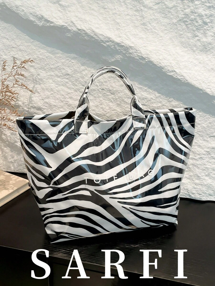 新款夏季个性化斑马纹设计女士手提包,街头风托特包,高端小众便携大容量收纳托特包,大学生日常通勤大容量收纳包,轻便实用大容量包,防水PVC材质魔术贴封口女士手提包,适合送礼、购物、约会、商务旅行及各种场合。 - 黑與白 - 查看 1