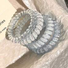 Conjunto de 5 elásticos de cabelo femininos azuis com estampa floral. Elásticos macios e de alta elasticidade, elegantes e versáteis, ideais para uso diário, ocasiões casuais, festas, deslocamentos, férias, penteados como rabo de cavalo, coque, para lavar o rosto e maquiar. Também podem ser usados como prendedores de cabelo, acessórios para casa e cuidados com a pele. - Azul - Ver 4