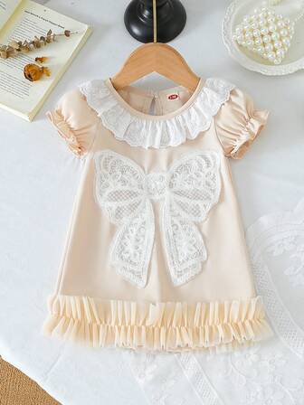 女宝宝时尚可爱圆领荷叶边泡泡袖蝴蝶结装饰连衣裙