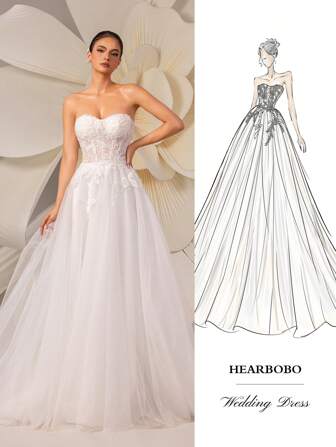 HEARBOBO 性感无袖婚纱，采用无肩带领口、长款网纱和精致贴花设计，打造优雅新娘造型