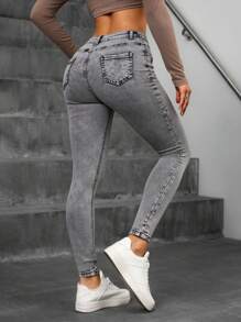 Mujer skinny jeans grises desgastados con botones múltiples