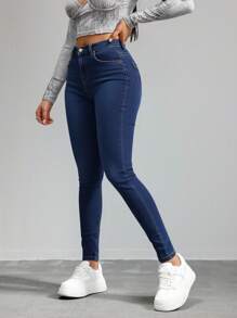 Jeans ajustados de cintura alta en azul marino, tela suave y elástica, ideal para estilos casuales y versátiles