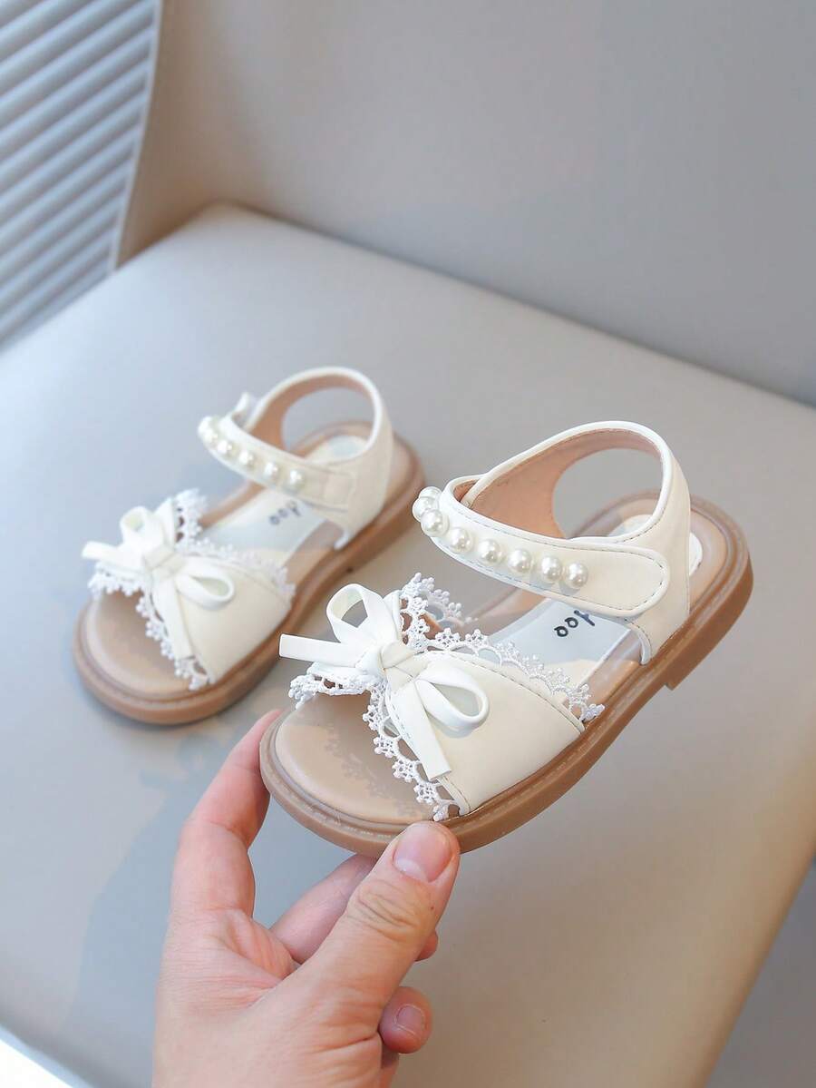 Zapatos planos de princesa para niñas con cierre de gancho y bucle, suela blanda antideslizante y diseño de perlas, estilo nuevo 2025