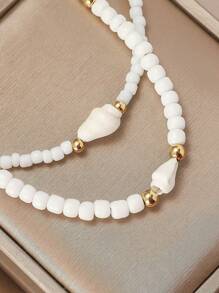Conjunto de gargantilha curta minimalista + pulseira, conjunto de acessórios artesanais com contas de concha, estilo praiano, moderno e iluminador