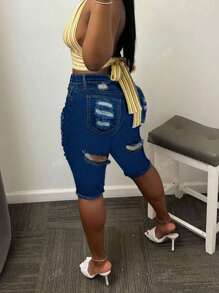 Pantalones cortos de mezclilla con dobladillo crudo desgarrado