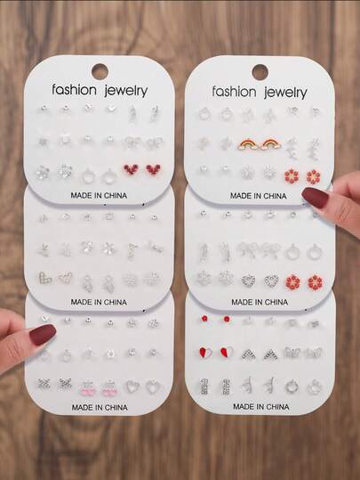 مجموعة 18 قطعة أقراط تصميم وهمية اللؤلؤ والكريستال والأوراق والفراشات والقلوب والثلج والنجوم والزهور الملونة وشعار الحب، مناسبة للاستخدام اليومي للنساء