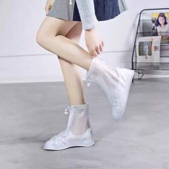 1 paar dikke, waterdichte en slipvaste regenoverschoenen tot halverwege de kuit, met ritssluiting, unisex