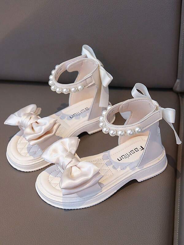 1双白色高帮可调节魔术贴珍珠缎带蝴蝶结编织儿童平底凉鞋，防滑耐穿，窄脚建议选大一码