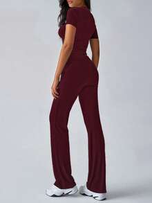 Wiosenne i jesienne damskie modne bluzki z krótkim rękawem odsłaniające pępek, dopasowane, sznurowane spodnie z rozszerzanymi nogawkami, sportowe garnitury