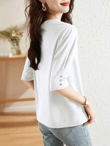 Blusa casual con decoración de botones y mangas a media manga, nueva moda de verano, camiseta versátil de cuello redondo y manga 3/4 para mujer, estilizadora