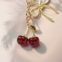 1 pieza Nuevo llavero de mujer con lazo de cereza de metal, accesorio de lazo de moda, colgante minimalista de estilo Ins para bolsa, regalo de vuelta al colegio