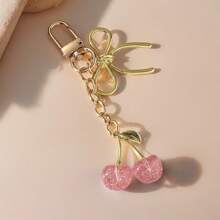 1 pieza Nuevo llavero de mujer con lazo de cereza de metal, accesorio de lazo de moda, colgante minimalista de estilo Ins para bolsa, regalo de vuelta al colegio