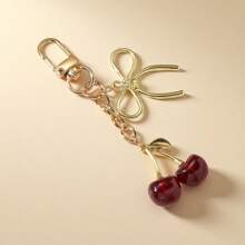 1 pieza Nuevo llavero de mujer con lazo de cereza de metal, accesorio de lazo de moda, colgante minimalista de estilo Ins para bolsa, regalo de vuelta al colegio