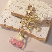 1 pieza Nuevo llavero de mujer con lazo de cereza de metal, accesorio de lazo de moda, colgante minimalista de estilo Ins para bolsa, regalo de vuelta al colegio