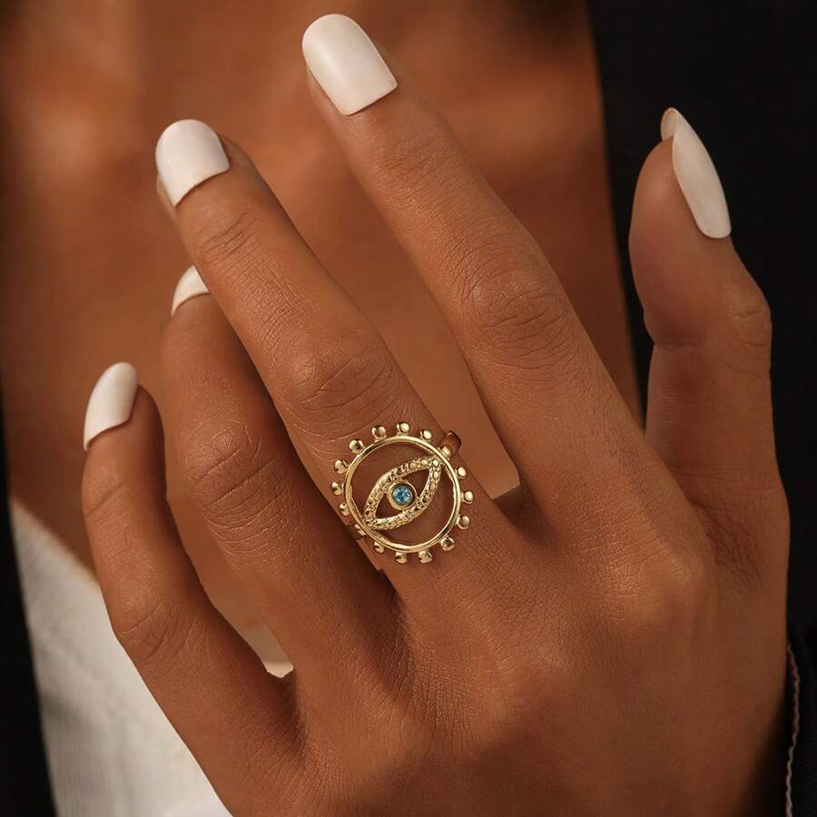 Edelstahl Ring mit goldtonem offenem Ausschnitt und blauem Auge