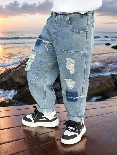 Jeans moda primavera per giovani ragazzo a vestibilità ampia con strappi e applicazioni a toppe